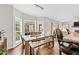 Bright dining area with hardwood floors and a view of the screened in porch at 435 Ruby Forest Pkwy, Suwanee, GA 30024