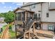 Exterior view of a two-story home with a deck and a well-maintained backyard at 435 Ruby Forest Pkwy, Suwanee, GA 30024