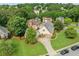 Aerial view of a traditional suburban home with a manicured lawn and driveway at 435 Ruby Forest Pkwy, Suwanee, GA 30024