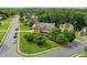 Traditional brick home with a manicured lawn on a corner lot with mature trees at 435 Ruby Forest Pkwy, Suwanee, GA 30024