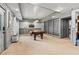 Entertaining game room with pool table, built-in shelving, and contemporary lighting at 435 Ruby Forest Pkwy, Suwanee, GA 30024