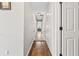 Hallway with hardwood floors and white doors at 435 Ruby Forest Pkwy, Suwanee, GA 30024
