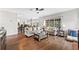 Open-concept living room featuring hardwood floors, comfortable seating, and seamless flow to kitchen at 435 Ruby Forest Pkwy, Suwanee, GA 30024
