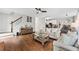 Spacious open-concept living area with hardwood floors, stairs to the second level, and access to the kitchen at 435 Ruby Forest Pkwy, Suwanee, GA 30024