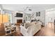 Cozy living room with fireplace, hardwood floors, and ample natural light at 435 Ruby Forest Pkwy, Suwanee, GA 30024