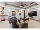 Cozy media room featuring comfortable seating, a large TV, and contemporary decor at 435 Ruby Forest Pkwy, Suwanee, GA 30024