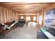 Partially finished basement with exposed framing and some furniture offers development potential at 50 Worthington Dr, Villa Rica, GA 30180