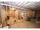 Unfinished basement with exposed framing and ductwork offers potential for customization at 50 Worthington Dr, Villa Rica, GA 30180