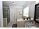 Bathroom featuring granite vanity, soaking tub and glass shower at 50 Worthington Dr, Villa Rica, GA 30180