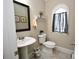 Powder room featuring pedestal sink and window at 50 Worthington Dr, Villa Rica, GA 30180