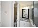 Bathroom featuring granite vanity, glass shower and tile flooring at 50 Worthington Dr, Villa Rica, GA 30180