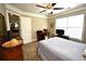 Bedroom with natural light, ceiling fan, and desk at 50 Worthington Dr, Villa Rica, GA 30180