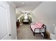 Bright bedroom in attic space featuring twin beds and a ceiling fan at 50 Worthington Dr, Villa Rica, GA 30180