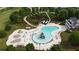 Community pool featuring a waterslide, splash pad, picnic tables, and plenty of lounge chairs at 50 Worthington Dr, Villa Rica, GA 30180