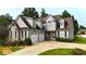 Charming two-story home boasting a two-car garage and lush front lawn at 50 Worthington Dr, Villa Rica, GA 30180