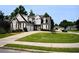 Two-story home featuring a well-manicured lawn, and two-car garage, perfect for suburban living at 50 Worthington Dr, Villa Rica, GA 30180