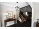 Inviting foyer features dark wood floors and staircase, leading into a bright living area with high ceilings at 50 Worthington Dr, Villa Rica, GA 30180