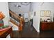 Inviting home foyer featuring hardwood floors, elegant staircase, and stylish decor at 50 Worthington Dr, Villa Rica, GA 30180