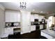 Well-appointed kitchen featuring white cabinetry and stainless steel appliances with a convenient desk area at 50 Worthington Dr, Villa Rica, GA 30180