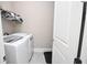 Bright laundry room with modern white washer and dryer, providing convenience and efficiency at 50 Worthington Dr, Villa Rica, GA 30180