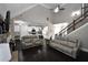 Bright, open-concept living room seamlessly connects to the kitchen and features elegant staircase access at 50 Worthington Dr, Villa Rica, GA 30180