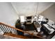 Open-concept living room with stone fireplace, dark hardwood floors, and a modern kitchen at 50 Worthington Dr, Villa Rica, GA 30180