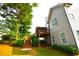 Back exterior view of home featuring a deck, screened porch, stairs, and lawn at 50 Worthington Dr, Villa Rica, GA 30180