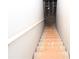 Staircase with handrail leads down to the basement at 50 Worthington Dr, Villa Rica, GA 30180