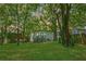 This home features a spacious backyard with a deck and patio area at 872 Beryl Sw St, Atlanta, GA 30310