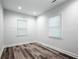 Spare bedroom featuring wood look flooring, natural light, neutral walls and trim at 872 Beryl Sw St, Atlanta, GA 30310
