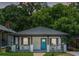 Charming home featuring a new roof, freshly painted exterior, and a bright blue front door at 872 Beryl Sw St, Atlanta, GA 30310