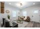 Bright living room with modern lighting, neutral walls, stylish decor and wood look flooring at 872 Beryl Sw St, Atlanta, GA 30310