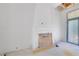 Room with fireplace featuring natural light from large window at 120 Wood River Ct, Johns Creek, GA 30097