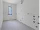 Unfinished bright room with a large window at 120 Wood River Ct, Johns Creek, GA 30097
