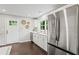 Spacious kitchen featuring stainless steel appliances, white cabinets, and a view of the outdoors at 1995 Venetian Sw Dr, Atlanta, GA 30311
