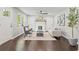 Cozy living room featuring hardwood floors, a white fireplace, and neutral decor at 1995 Venetian Sw Dr, Atlanta, GA 30311