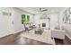 Bright living room with hardwood floors, fireplace, and modern furnishings at 1995 Venetian Sw Dr, Atlanta, GA 30311