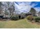 Spacious backyard featuring a storage building and gazebo, ideal for outdoor activities and entertaining at 202 Heights, Canton, GA 30114