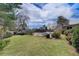 Beautiful backyard showcasing a pool, gazebo, and lush landscaping, creating a private retreat at 202 Heights, Canton, GA 30114