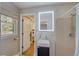 Modern bathroom with sleek vanity, walk-in shower, and natural light from the window at 202 Heights Pl, Canton, GA 30114