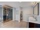 Modern bathroom boasting a glass shower, tile floors, and double sinks for added convenience at 202 Heights, Canton, GA 30114