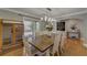 Bright dining room featuring hardwood floors, stylish lighting, and access to the outdoor deck at 202 Heights, Canton, GA 30114