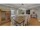 Dining room featuring hardwood floors, decorative lighting, and lots of natural light at 202 Heights Pl, Canton, GA 30114