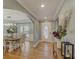 Inviting foyer featuring hardwood floors, decorative lighting, and access to the dining room at 202 Heights Pl, Canton, GA 30114
