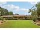 Charming single-story home featuring a covered front porch and a meticulously landscaped front yard at 202 Heights, Canton, GA 30114