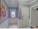 Spacious entry hall with beadboard accents, transom window, and access to outdoor living at 202 Heights, Canton, GA 30114