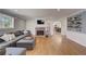 Cozy living room with a brick fireplace, hardwood floors, and stylish decor, perfect for relaxing at 202 Heights, Canton, GA 30114