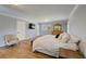 Bright main bedroom featuring hardwood floors, ensuite bath, and multiple windows at 202 Heights, Canton, GA 30114