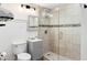 Cozy bathroom featuring a glass enclosed shower, a modern vanity, and natural colored tile at 215 Piedmont Ne Ave # 1109, Atlanta, GA 30308