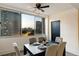 Inviting dining room features large windows with city views and a modern ceiling fan at 215 Piedmont Ne Ave # 1109, Atlanta, GA 30308